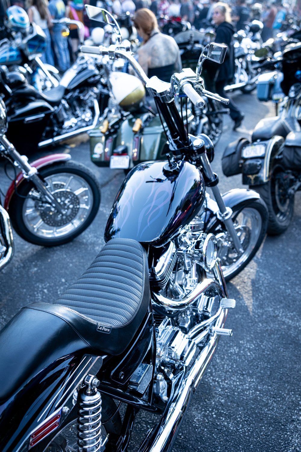 Row of custom Harleys lined up at the Proper Baggers Performance Show
