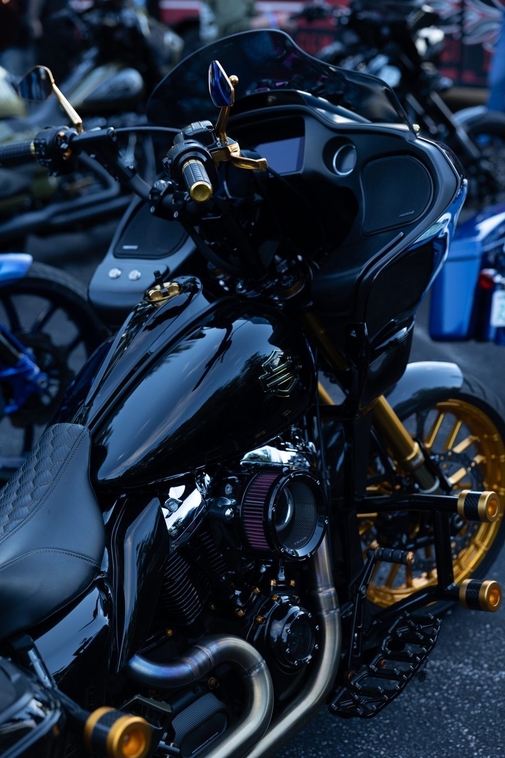 Black and blue Road Glide with gold accents at the Proper Baggers show