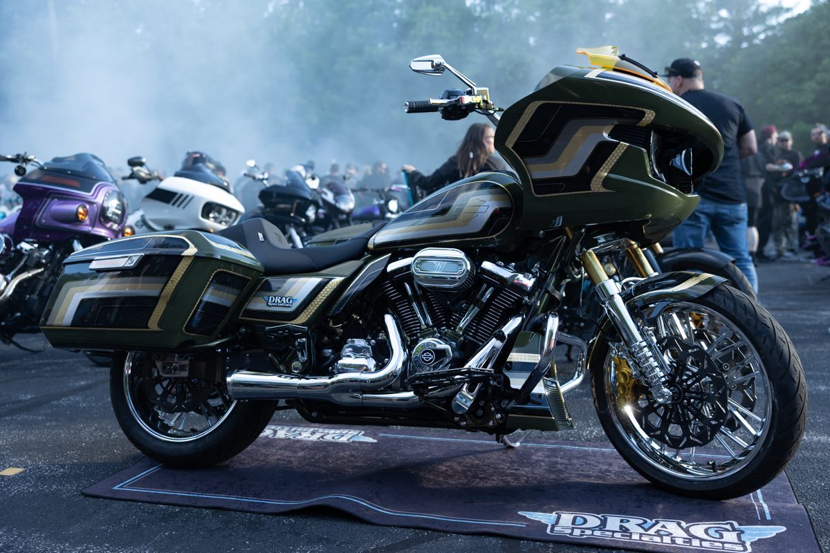 Olive green performance bagger on display with smoke in the background