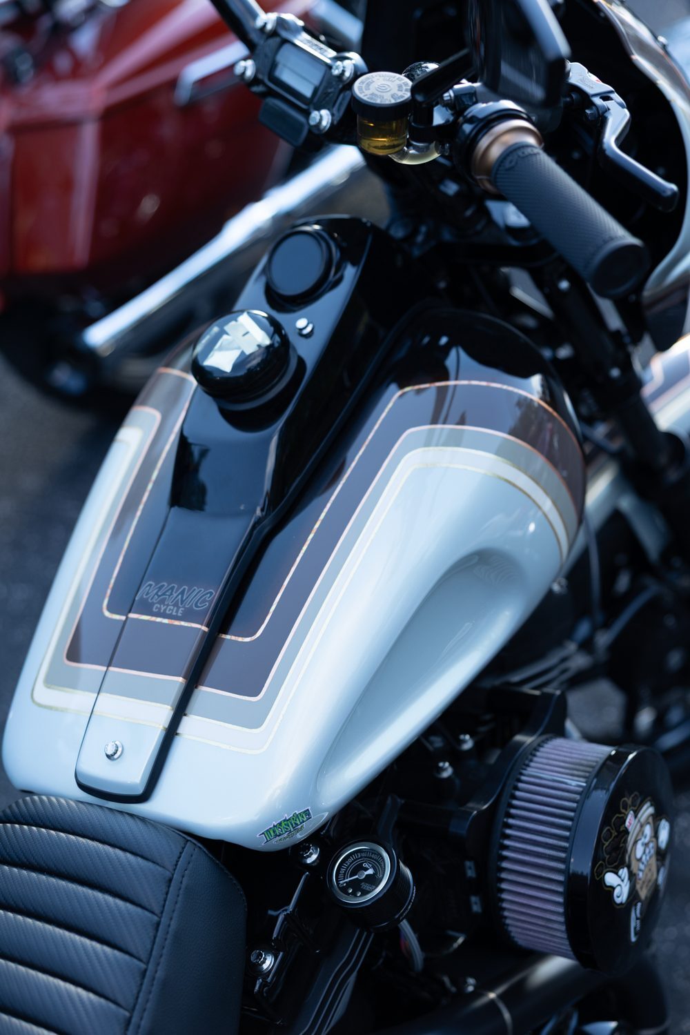White and black custom tank detail at the Proper Baggers show